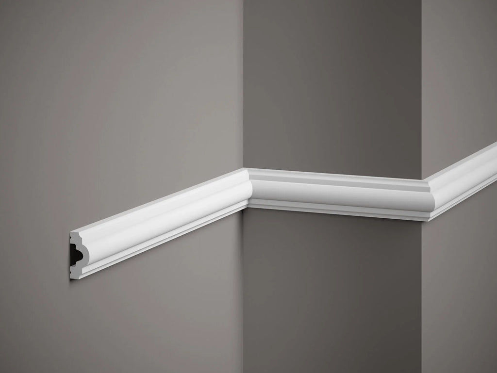White crown molding on a gray wall