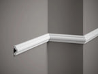 White crown molding on a gray wall