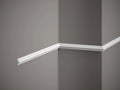 White crown molding on a gray wall