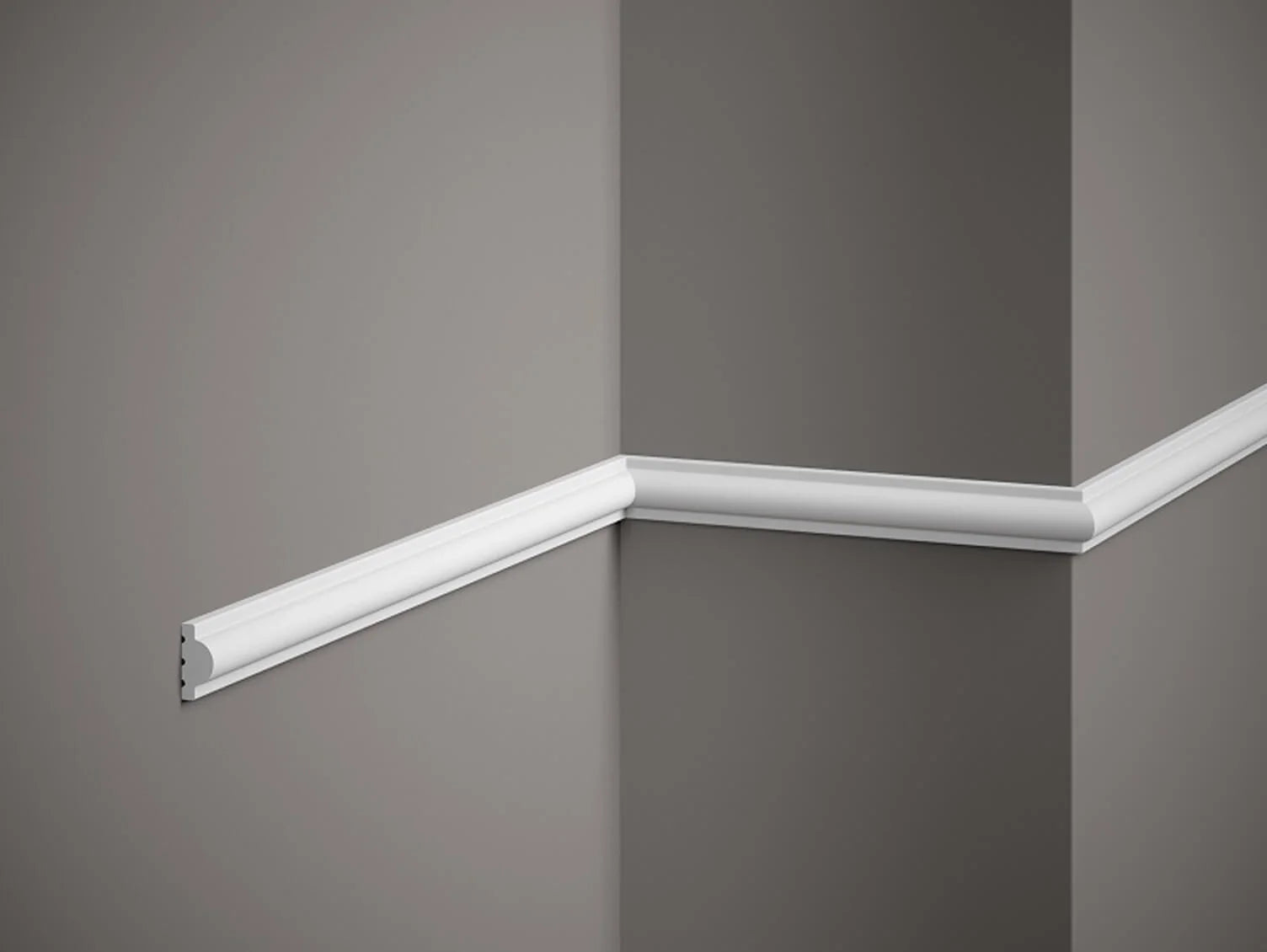 White crown molding on a gray wall corner