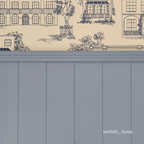 Wallpaper with architectural design and a tongue and groove panelled wall below