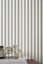 Decorative object on a surface with a ribbed wall panelling background
